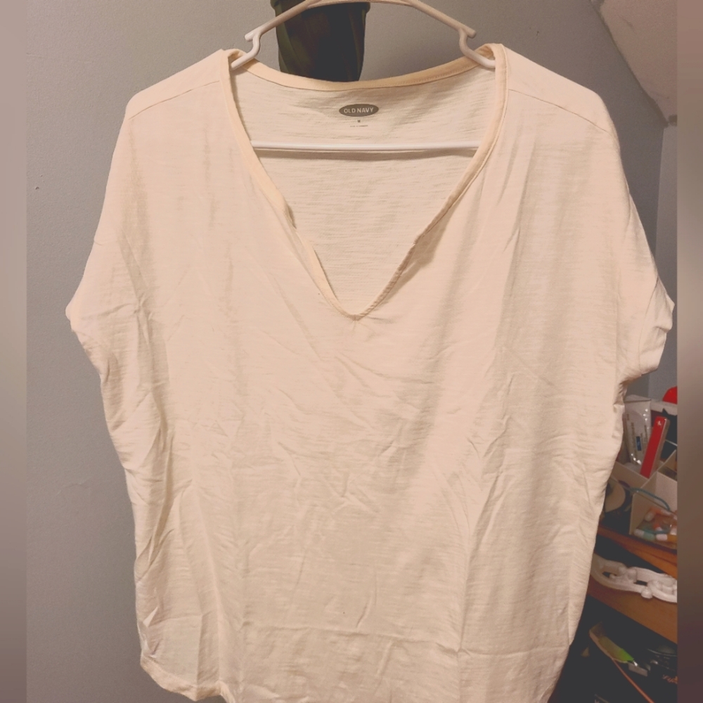 Cream colored v neck tee shirt